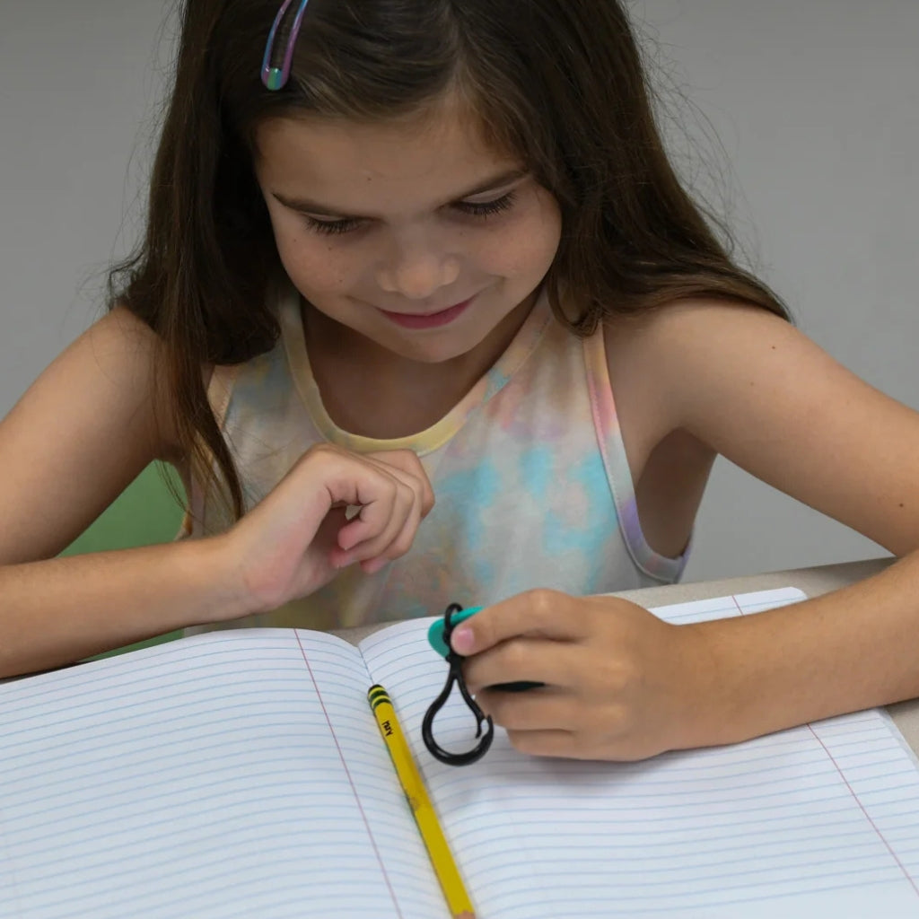 Girl holding calming clips