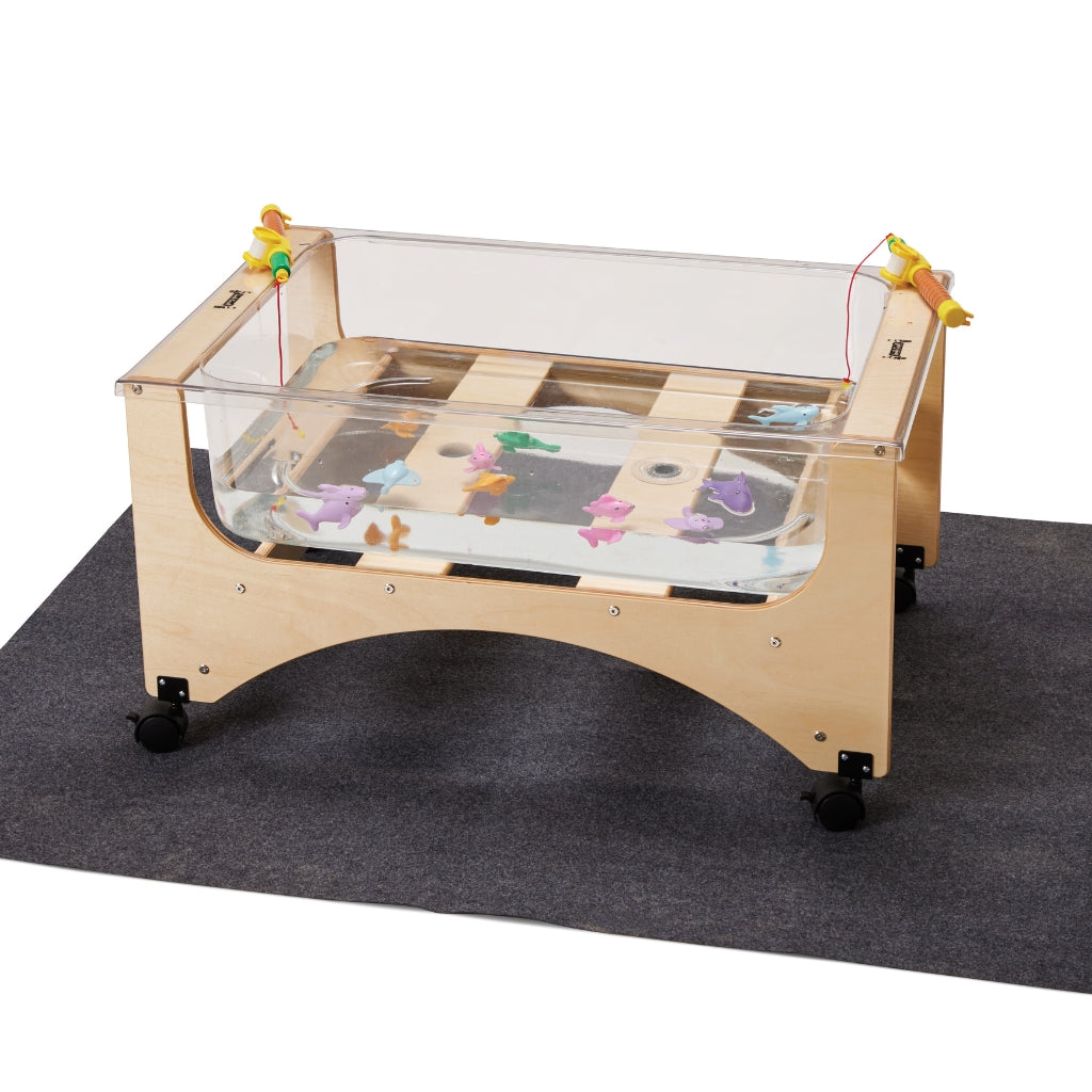 Wooden activity table with transparent top on a black mat
