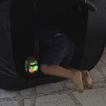 Video of boy going in and playing in a sensory blackout tent