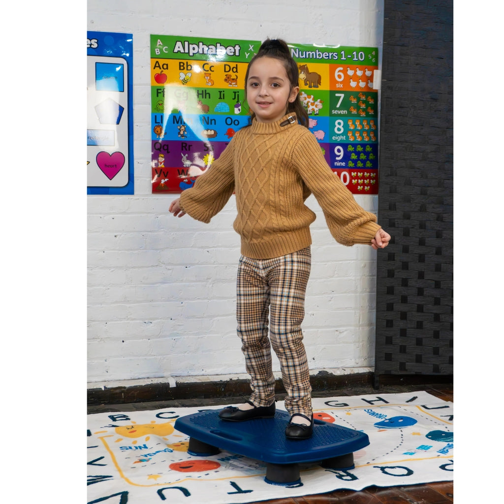 Girl standing on a bouncy board