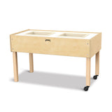 Wooden sensory table with white trays on a white background