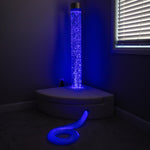 Bubble tube glowing blue with fibre optic strands and corner seating